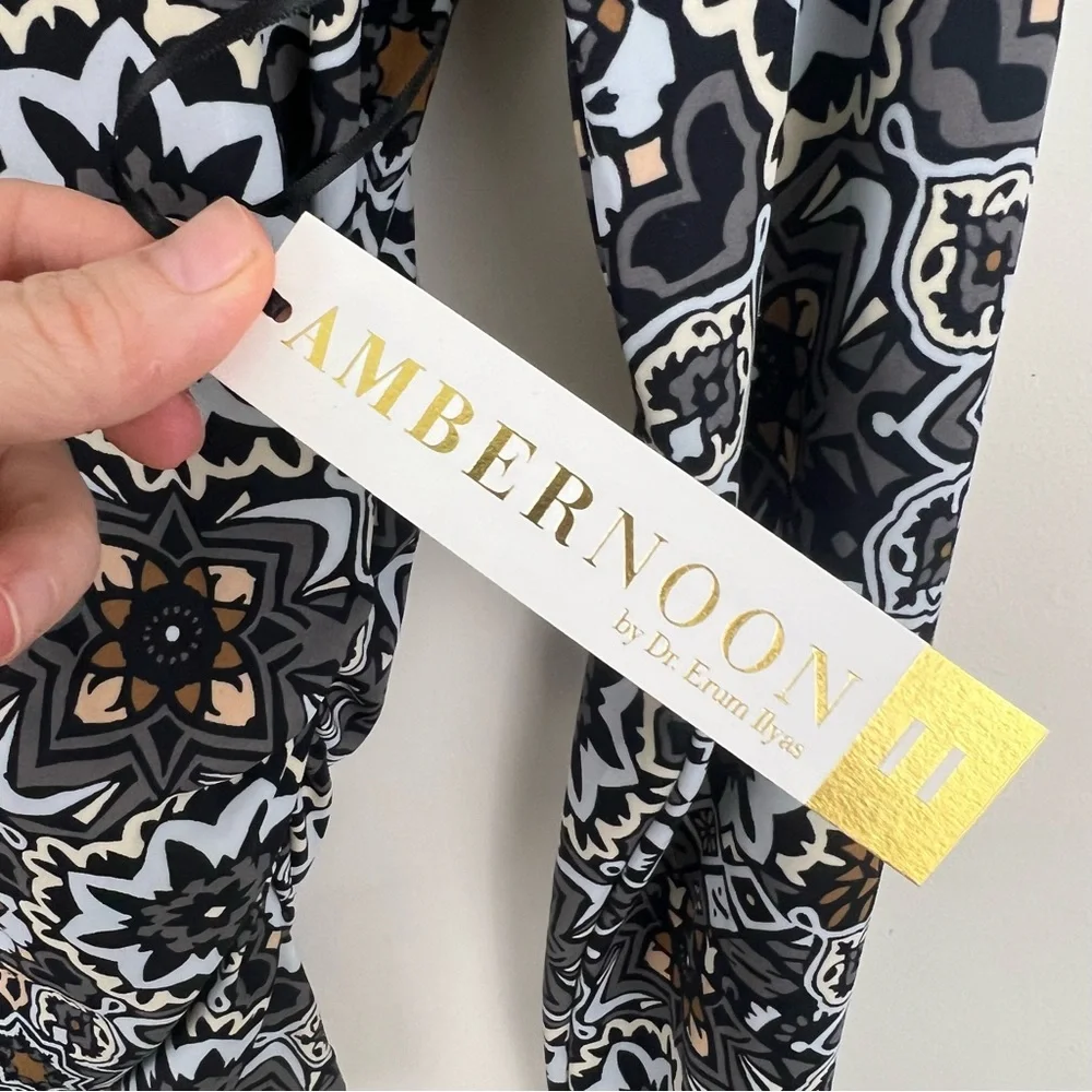 Ambernoon II by Dr. Erum Ilyas Floral Print 1/4 Zip Roll Tab Sleeve Rash Guard